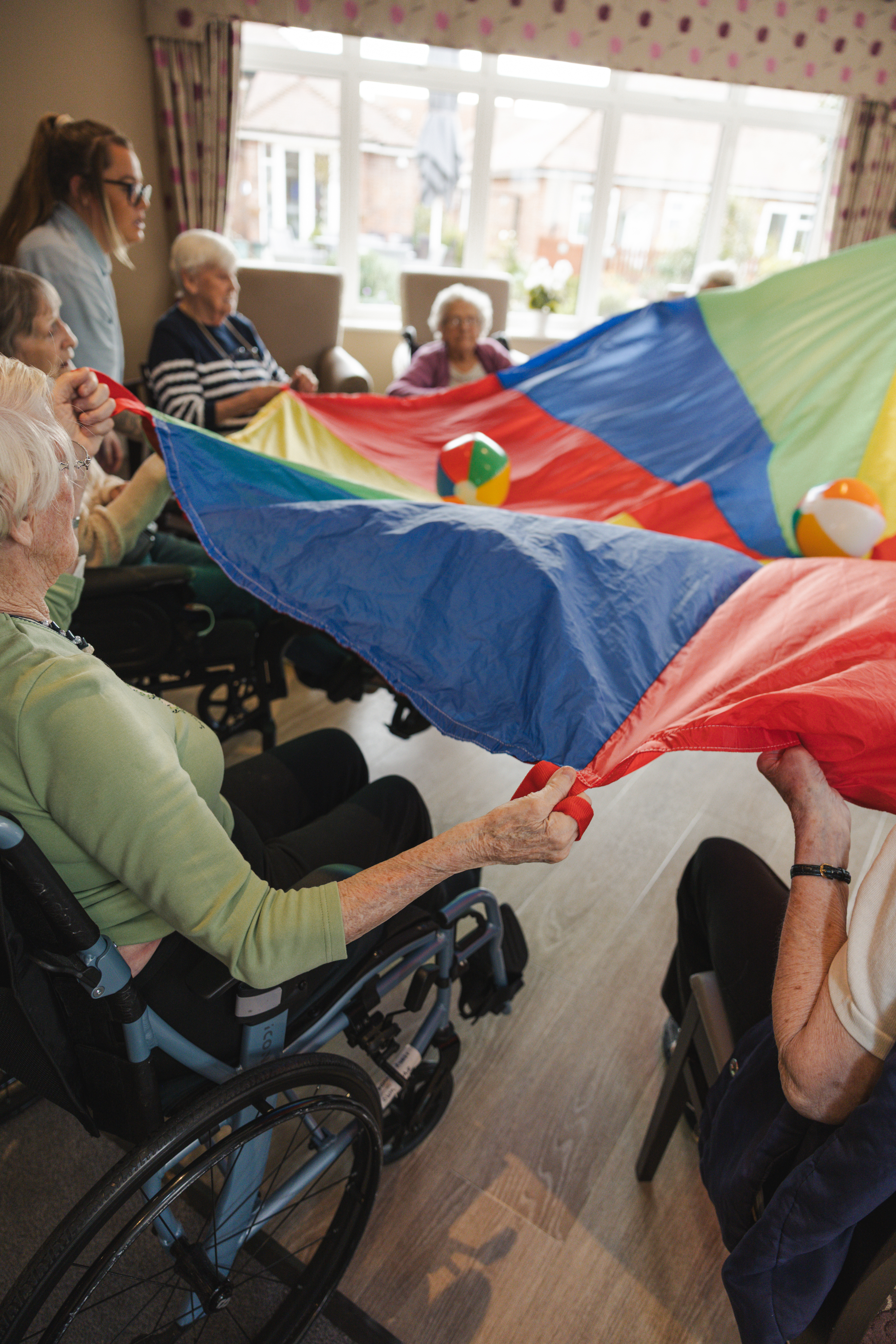 Residents and staff enjoying a lively activities session at Mistley Manor