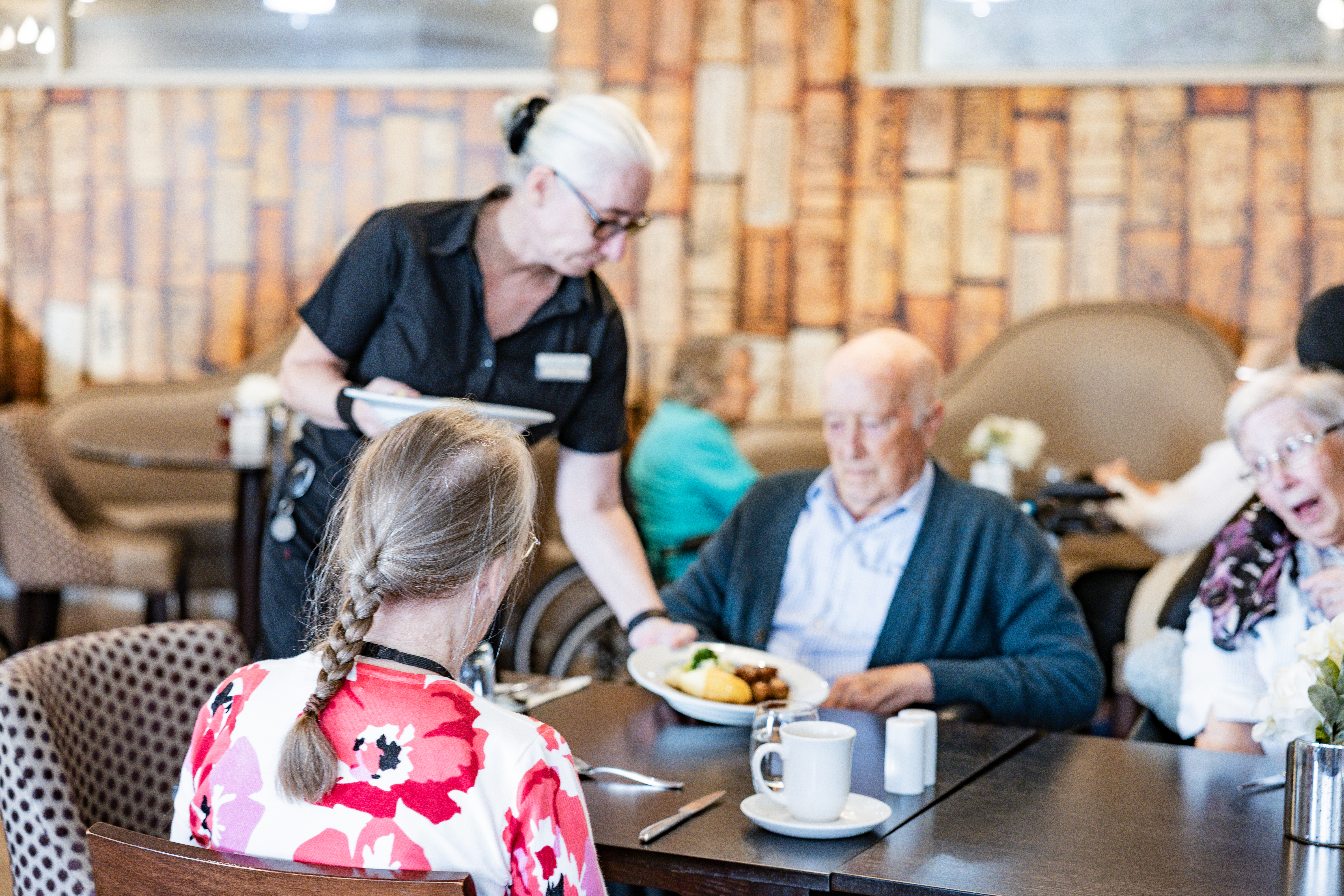 Staff serving lunch to residents in the Swan Restaurant